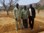 Zakari and teachers - seeing the start of work for the 3 extra classrooms.